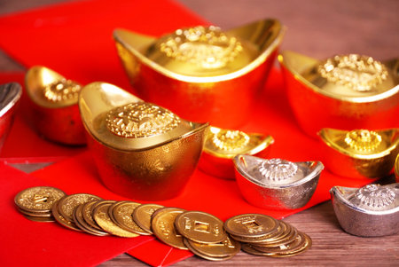 Gold bar and silver with red envelope decorate for chinese new year themeの写真素材