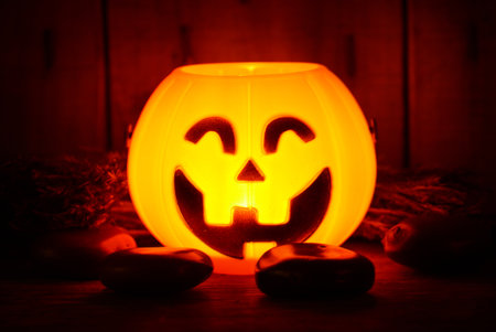 Light growing on pumpkin smile decorate for halloween night have space for ideaの写真素材