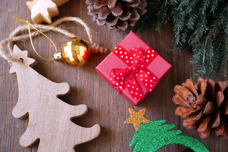 Topview layout red gift box on the table which decorate for christmas theme