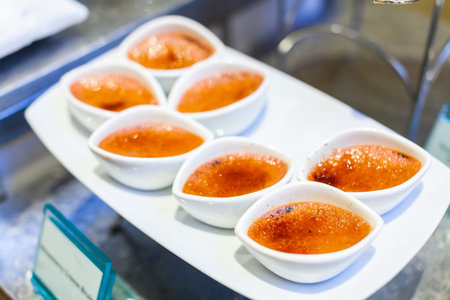 Group of Strawberry Creme Brulee on White Plateの写真素材