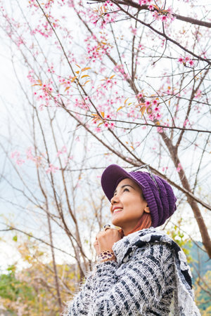 Girl Happy with Wild Himalayan Cherry Blossomの写真素材