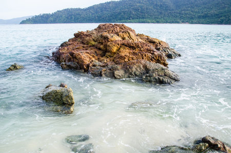 Wave on the beach and rockの写真素材