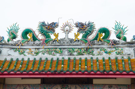 Dragon statue on Shrine roofの写真素材