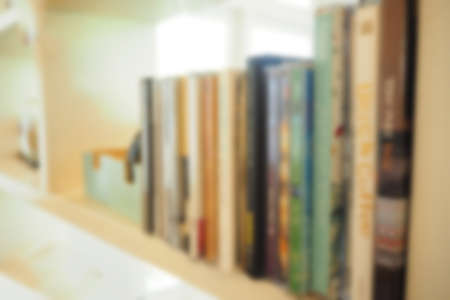Blurred abstract background of Books placed on shelvesの写真素材