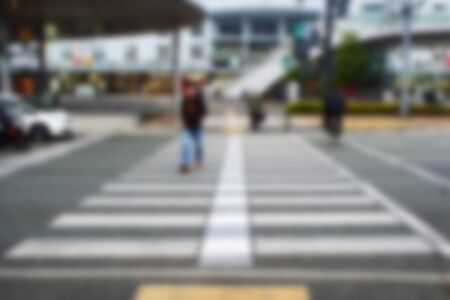 Blurred abstract background of People crossing a street crosswalkの写真素材
