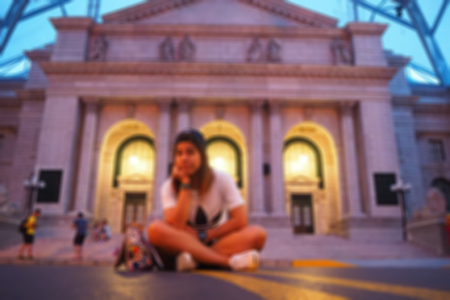 Blurred abstract background of American high school students sitting in front of the school.のeditorial素材