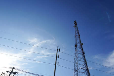 Silhouette, telecommunication towers with TV antennas and satellite dishの写真素材