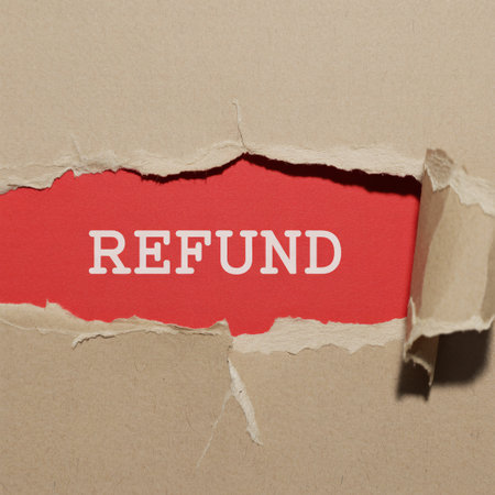 A conceptual image showing the word Refund printed on a red background, visible through a jagged hole in ripped brown paper, representing customer returns and money back guarantees.の素材