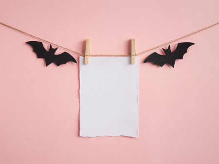 halloween mockup with bats and blank paper. perfect for your text or design with copy space hereの素材
