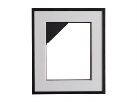 A black picture frame with a white mat, creating a visual contrast. The frame surrounds an empty space, ready for artwork or a photograph.の素材
