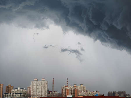 Dramatic cumulonimbus stormy clouds over city of Shanghai, China.の写真素材