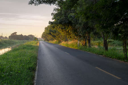 Roads, rural canal To reflect the morning sunの写真素材