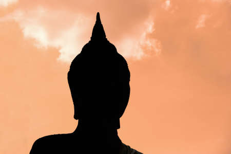 Buddha face statue silhouette closeupの写真素材