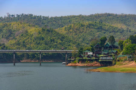 Kanchanaburi, Thailand - February 19, 2018: Large bridge made of mortar  from one side to the other side of the river, Mon Bridgeの写真素材