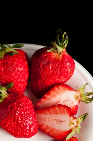 Fresh strawberries on blackの写真素材