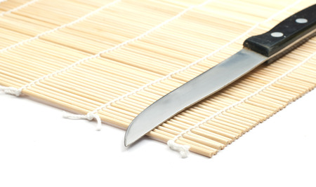 knife on bamboo mat