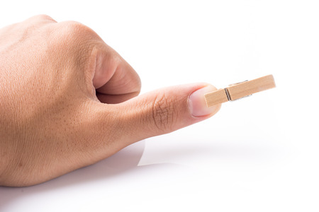 Wooden peg on fingerの写真素材