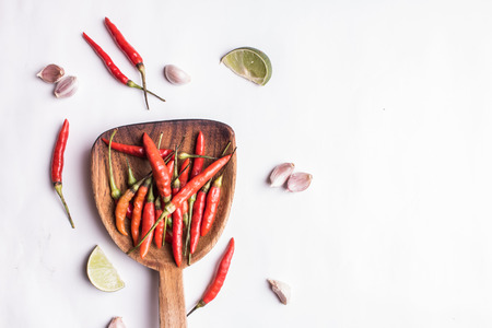 herbs and spices with wooden mortar isolated on white backgroundの写真素材