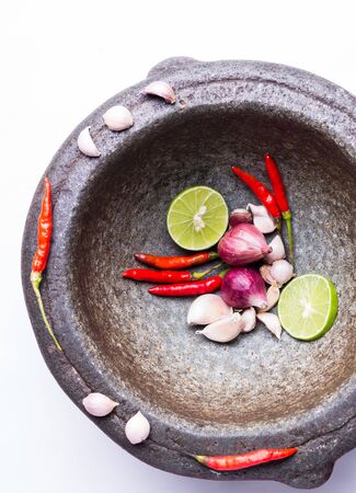 herbs and spices with mortar isolated on white backgroundの写真素材