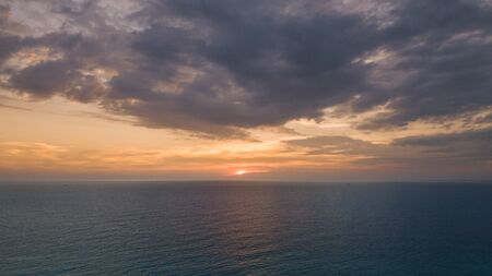 Beautiful sunset time on sea , tranquil scenic nature backgroundの写真素材