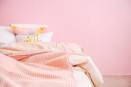 Pink pastel wall tone bedroom, cozy pink bed and pillow