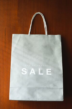 paper bag with Sale tag , midnight sale season end of the yearの写真素材