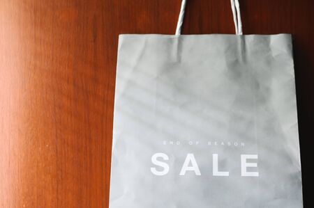 paper bag with Sale tag , midnight sale season end of the yearの写真素材