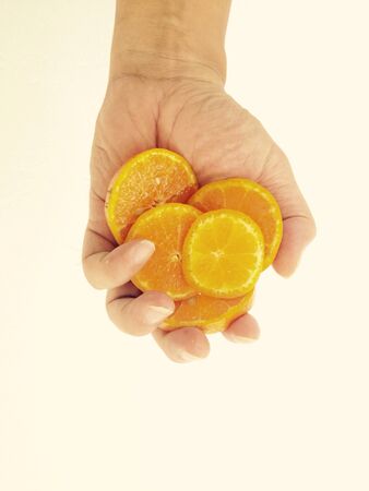 Fresh orange in handの素材