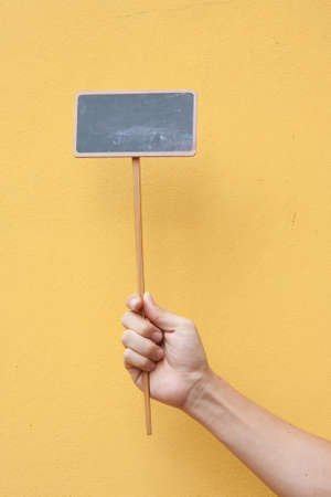 Blank chalkboard for text on yellow backgroundの写真素材