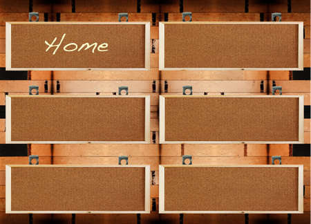 Blank banner made of cork with metal hanger on wood wall, for text menuの写真素材
