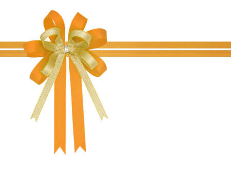 Orange and gold satin gift ribbon bow on white backgroundの写真素材