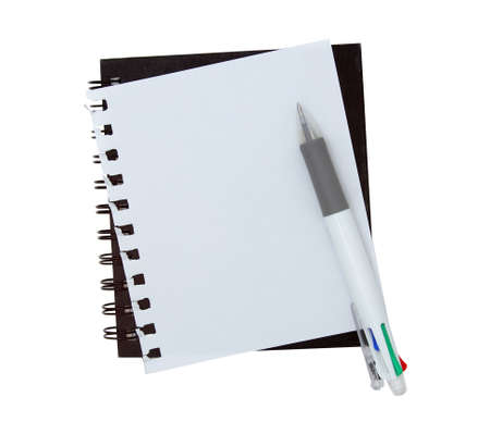 Notebook paper with pen on white backgroundの写真素材