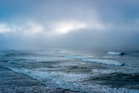 Seascape. Waves in the ocean on a cloudy day.の写真素材