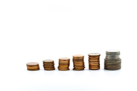 Coins stacked on a white background Growth concept Business finance And the availability of a...