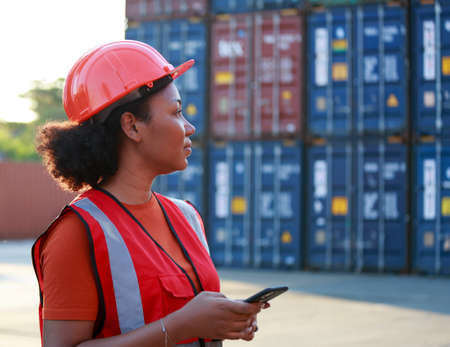 Portrait of an employee or supervisor Smiling African American woman container worker in the hard...