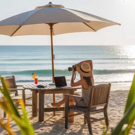 Beachside Photographer Working Under Umbrella with Ocean Viewの素材
