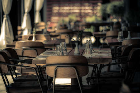 Restaurant table set up for diners. Romantic late evening fine dining date dinner.の写真素材