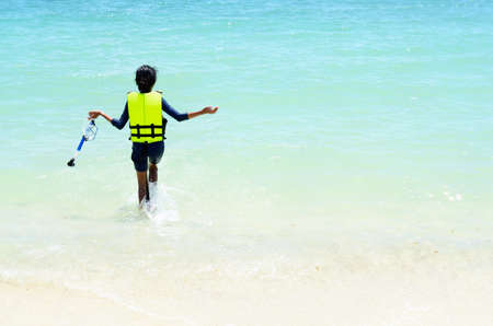 Girl having fun on the beach の写真素材