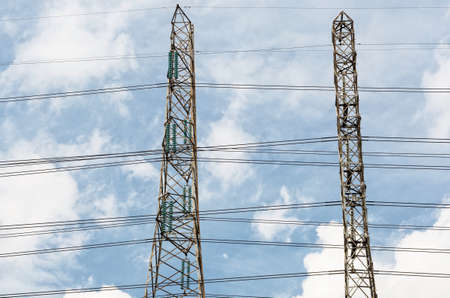 Power transmission lines against blue sky