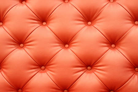 Red leather sofa texture backgroundの写真素材