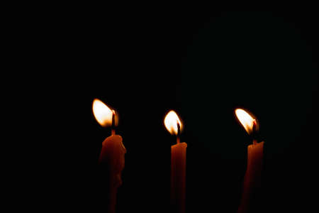 Group of Candles light on black backgroundの写真素材