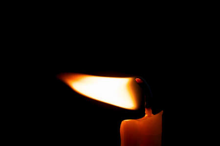 One Candle light on black backgroundの写真素材