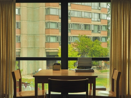 study table chair in front of a window