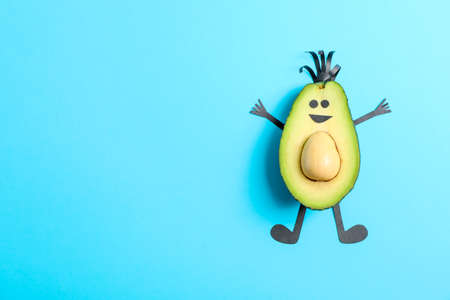 Happy avocado on color background, space for text