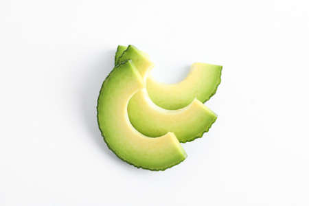 Fresh avocado slices on white background, space for text. Top view