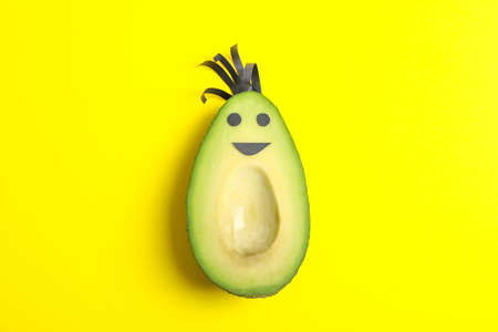 Happy avocado on color background, space for textの写真素材