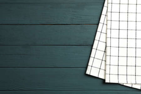 Fabric napkin on wooden background, space for textの写真素材