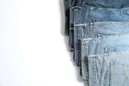 Jeans of different colors isolated on white background, space for textの写真素材