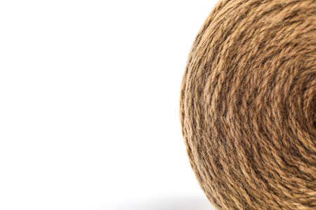 Spool of hemp rope on white background