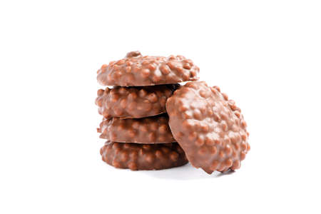 Stack of chocolate cookies with caramel filling isolated on white background